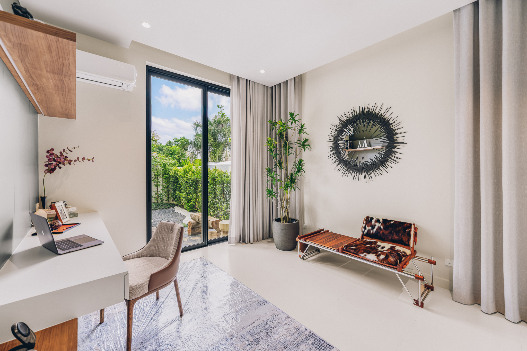 Open-plan living room and saltwater pool view